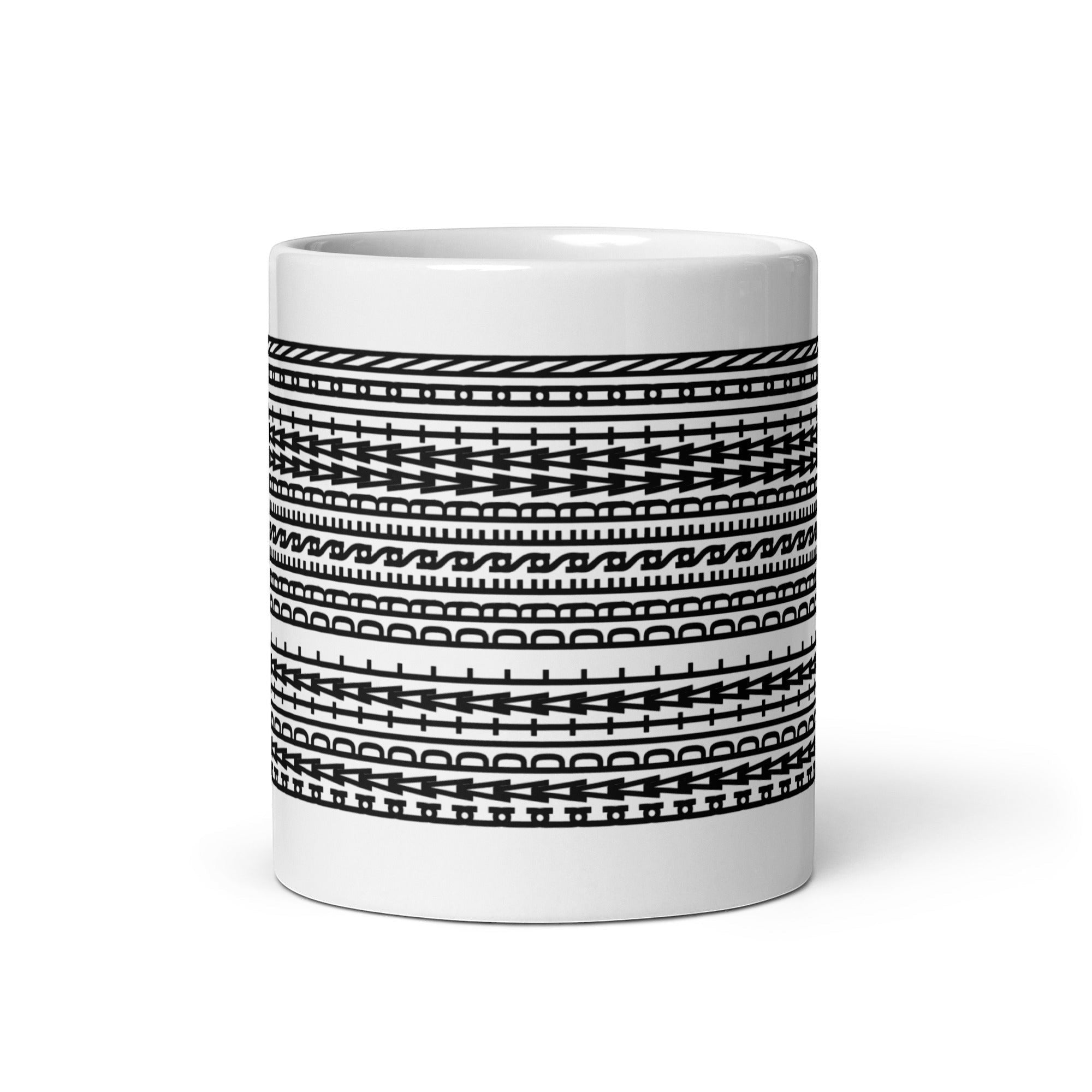 Trader Id Capital Preservation mug with abstract geometric pattern and tribal shield design. White ceramic.